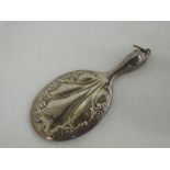 A miniature HM silver hand mirror having moulded decoration