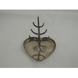 An HM silver ring stand having plain heart shaped base and branch stand, marks worn