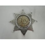 An Edwardian silver Ancient Order of Foresters sash badge having central gilt moulded glazed