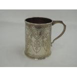 A Victorian silver tankard of small form having extensive engraved decoration, London 1868, John,