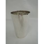 An Edwardian silver beaker of plain form having rollover rim, London 1905, Charles Boyton & Son Ltd