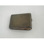 A silver match card holder having engine turned decoration and gilt interior, Birmingham 1935,