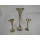 A Victorian silver bud vase trio having frilled rims and tapered stems to weighted bases, London