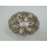 A Victorian silver circular trinket dish having pierced and repousse star and chequered decoration