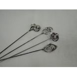 Three Edwardian and later silver hat pins having scroll and twist tops, Chester 1908/12, Charles