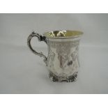 A Victorian silver tankard/mug having brightcut decoration with monogram to cartouche,gilt interior,