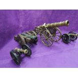 A selection of vintage miniature scale model canons including brass and cast iron replicas