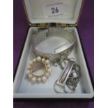 Three pieces of costume jewellery including a Monet pearl wreath brooch, Tissot wrist watch and a