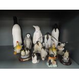 A large selection of penguin theme figures and figurines