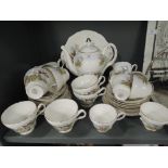 A part tea service by regency bone china with horse racing motiff