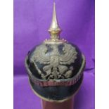 A German World War 1 black leather and brass Pickelhaube helmet with original leather fittings, Mit.