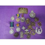A collection of military badges and medals including pair of World War 1 medals to 243676 Pte. E