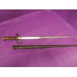 A French Gras rifle bayonet model 1874 with scabbard, inscribed 1875