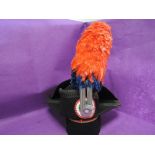 A reproduction 18th century French Tricorn hat with large blue and red hackle