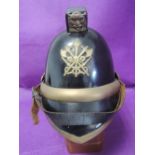 An early 20th century leather and brass British fireman's helmet