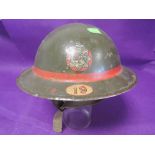 A World War II National Fire Service helmet No19m with original leather lining and chin strap