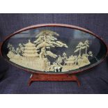 A vintage Japanese cork diorama landscape in oval frame