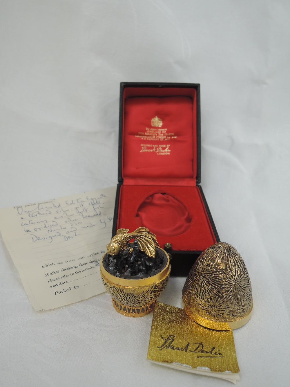 A cased Stuart Devlin 1971 silver gilt limited edition surprise Easter egg having a textured star - Image 2 of 2