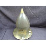 A trench art dinner gong possibly a nose from a large shell