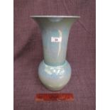 A late 20th century ceramic vase by Tobias Harrison, of blue lustre design, signed