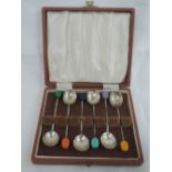 A cased set of six silver coffee spoons having coloured coffee bean knops, Sheffield 1959, Cooper