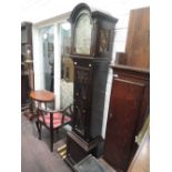 An early/mid 20th century dark oak longcase clock in the 18th style having arch hood and face with