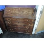 An early 19th century mahogany bureau having fall flap and fitted interior over 4 long graduated