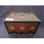 A 19th century cast metal money box having floral painted decoration