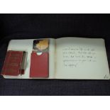 A vintage autograph album having early 20th script and illustrations and a set of vintage Panama