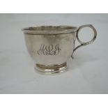 A small silver mug of plain form with loop handle and monogrammed ALJ, Birmingham 1933, David