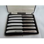 A cased set of silver handled knives having moulded handles, Sheffield 1938, Harrison Fisher & Co