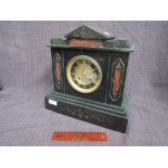 A late Victorian/Edwardian black marble mantel clock of architectural style having rouge marble