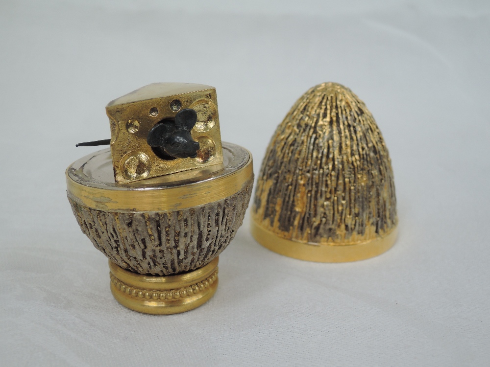 A cased Stuart Devlin 1972 silver gilt limited edition surprise Easter egg having a textured