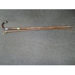 A vintage walking stick having HM silver knop and a vintage horn handle walking cane