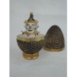 A cased Stuart Devlin 1973 silver gilt limited edition surprise Easter egg having a textured