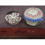 A vintage glass paperweight of millefiori design in the Baccarat style and a similar glass