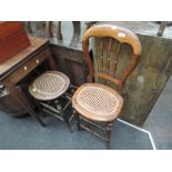 A late Victorian stained frame high chair having spindle and balloon back with cane seat and