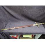 A copy English, two handed broadsword with brass guard and pommel wired handle, 91cm blade,