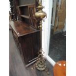 A late Victorian brass oil lamp converted to electric of Art Nouveau scroll design