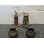 Two vintage bronze pots of 'cook pit' form with British Military brand arrow marks, a Hockley