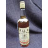 An old bottle of Bells Whisky 70% proof, 26 2/3 fl oz