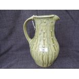 A Studio Pottery jug by Jim Malone of Sgraffito and nuka drip glaze form with JM mark and A for