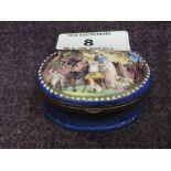 A 19th century enamelled patch box of oval shape having 18th century pictorial design decoration