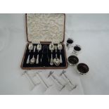 A cased part set of HM silver teaspoons and matching nips, pair of plated salts with frilled rims,