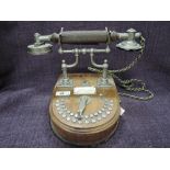 An early 20th century domestic telephone of chrome and treen design