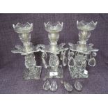 Three early 21st glass candlesticks having lustre drops