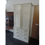 A traditional white painted full height kitchen cabinet having double cupboard and 3 long drawers