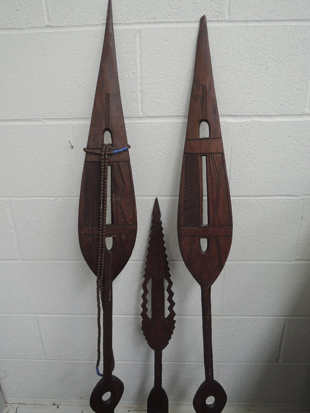 Three treen ethnic tribal spears of ceremonial African design