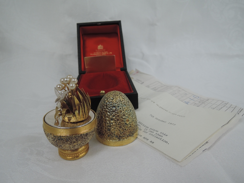 A cased Stuart Devlin 1978 silver gilt limited edition surprise Easter egg having a textured mottled - Image 2 of 2