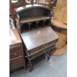 An 18th Century oak bible box lecturn having drawers with later additional arch shelf superstructure